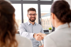 Job candidate shaking hands after an interview. 